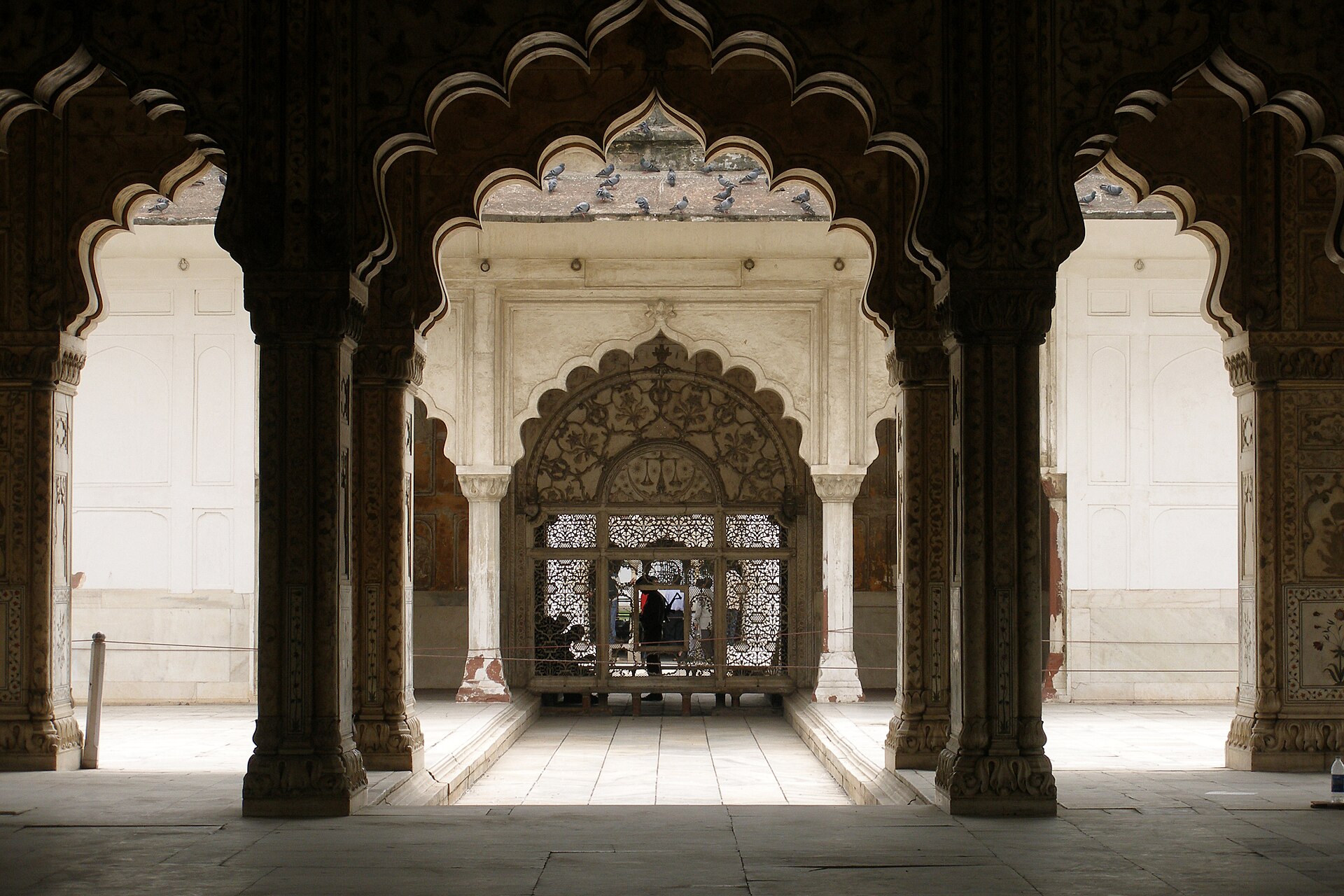 Intricate arches and marble details define this historic structure at Agra Fort, showcasing the beauty of Indian cinema's.